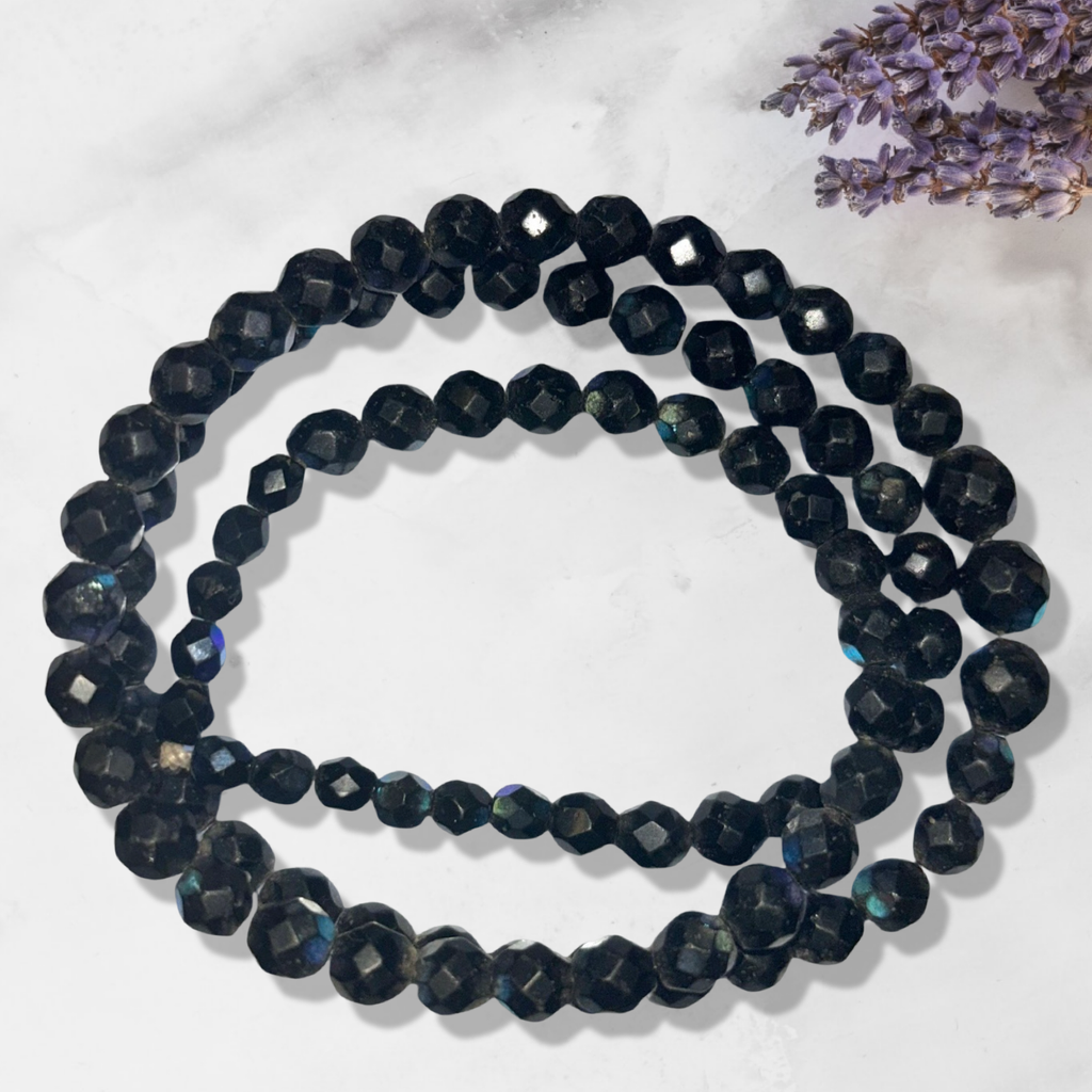 Iridescent black faceted beads from Bohemia